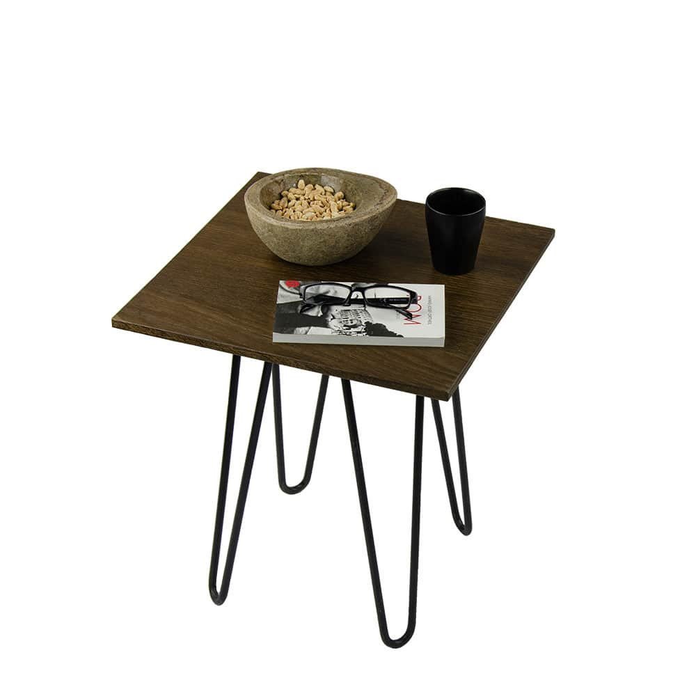 Square side table with hairpin legs in oak smoked finish decorated with glasses, book, tumbler and nibbles