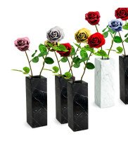 Black and white marble vases in square design decorated with colorful roses