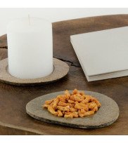 Candle plate holders RIVA made of riverstone in stone-beige with candle and nibbles decorated on side table