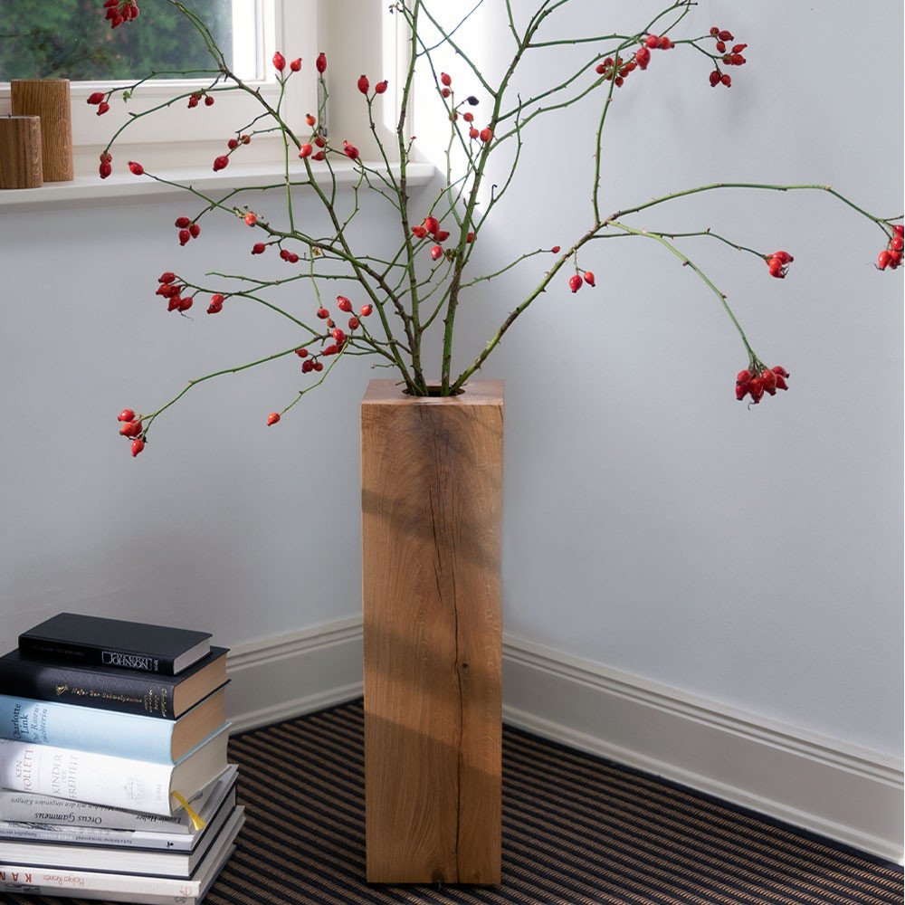COLUMN 55 wooden floor vase in natural oiled finish decorated with rose hip branches