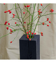 Floor vase COLUMN 70 made of oak in yakisugi decorated with rosehip branches, cut view