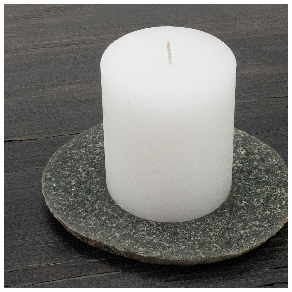 RIVA-S candle plate made of river stone in stone gray with white pillar candle on bog oak plate