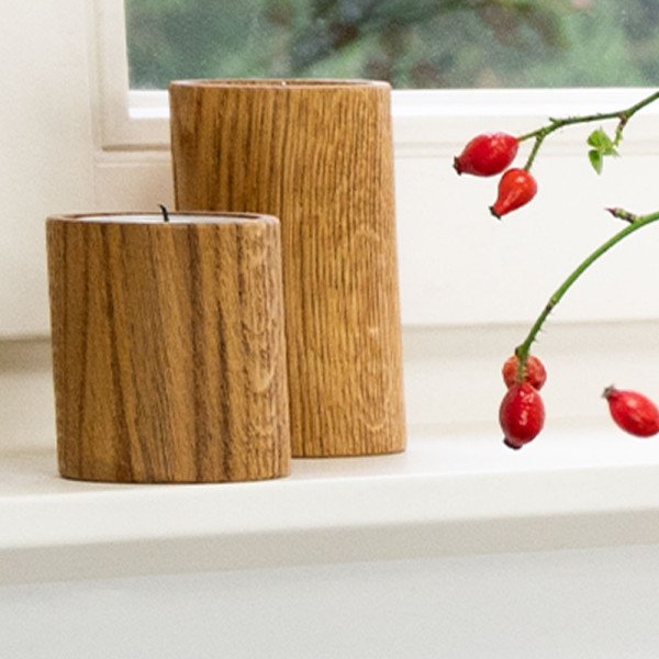 Tealight holder STUV 8 and 12 made of natural oiled oak on a windowsill with rose hips in the cut