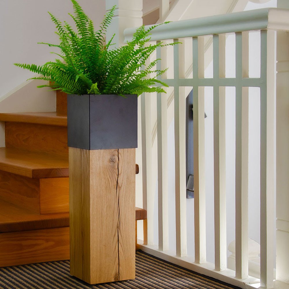 Pillar Pillum 64 natural oiled decorated with fern in the hallway